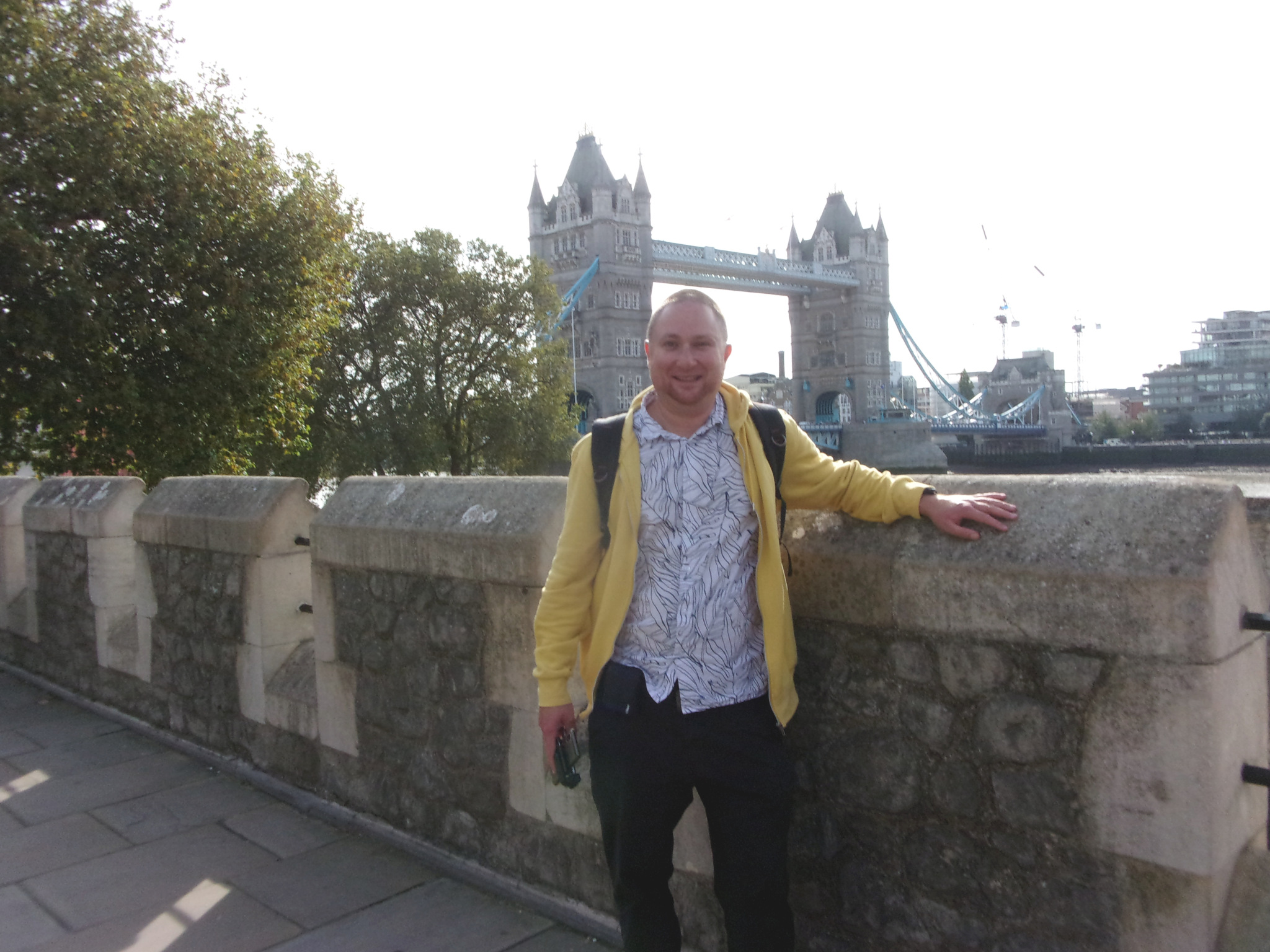 In front of the Tower Bridge at the Tower of London.