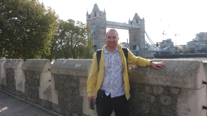 In front of the Tower Bridge at the Tower of London.