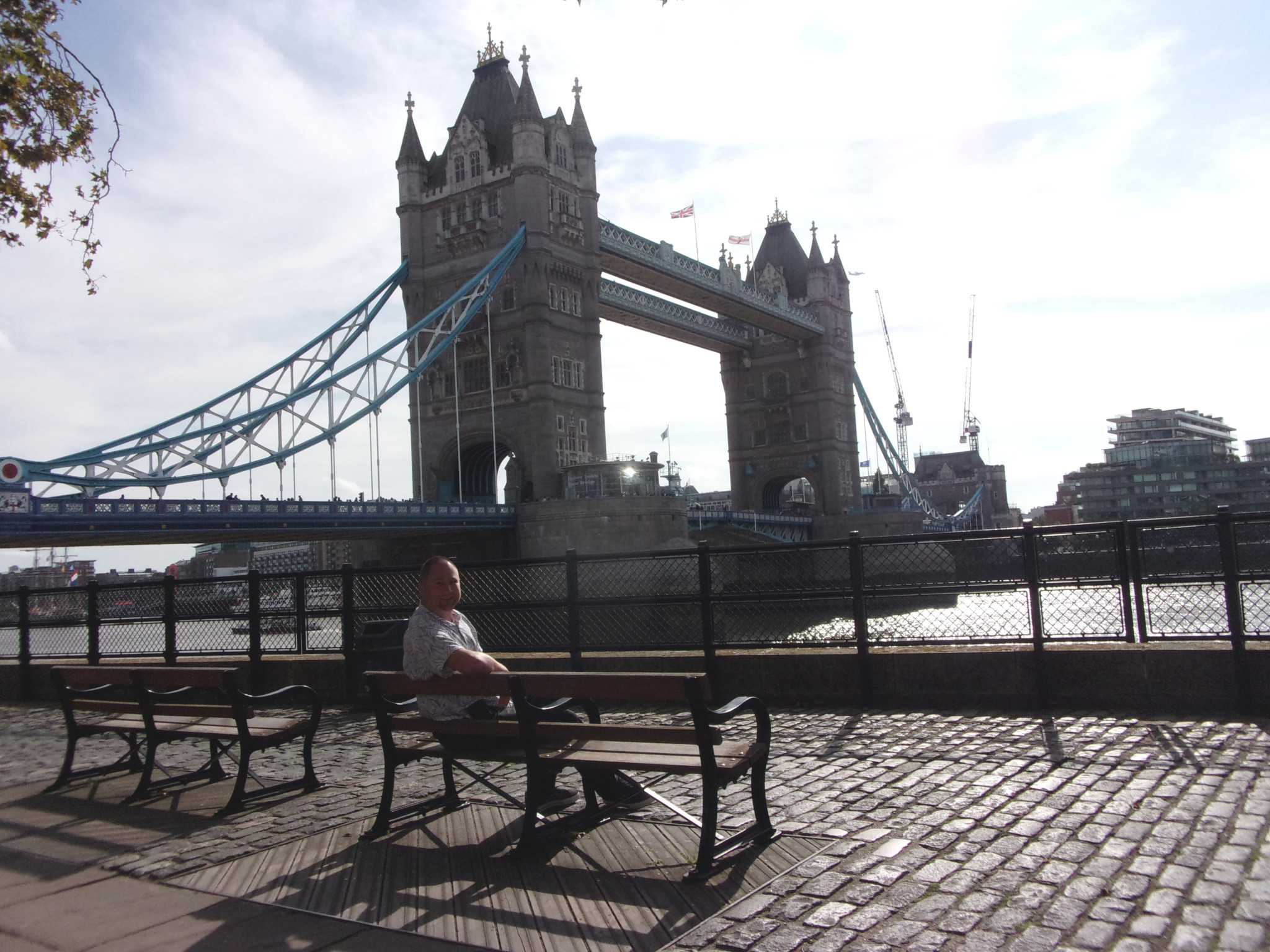 Tower Bridge as seen from the riverbank of the Thames.