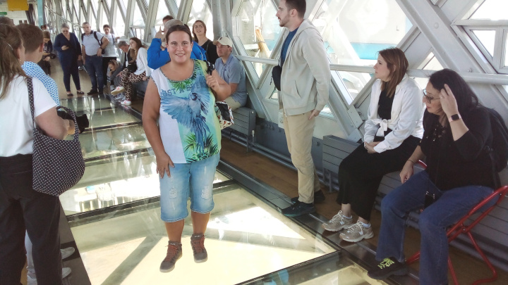 On the glass floor of one of the high-level walkways.